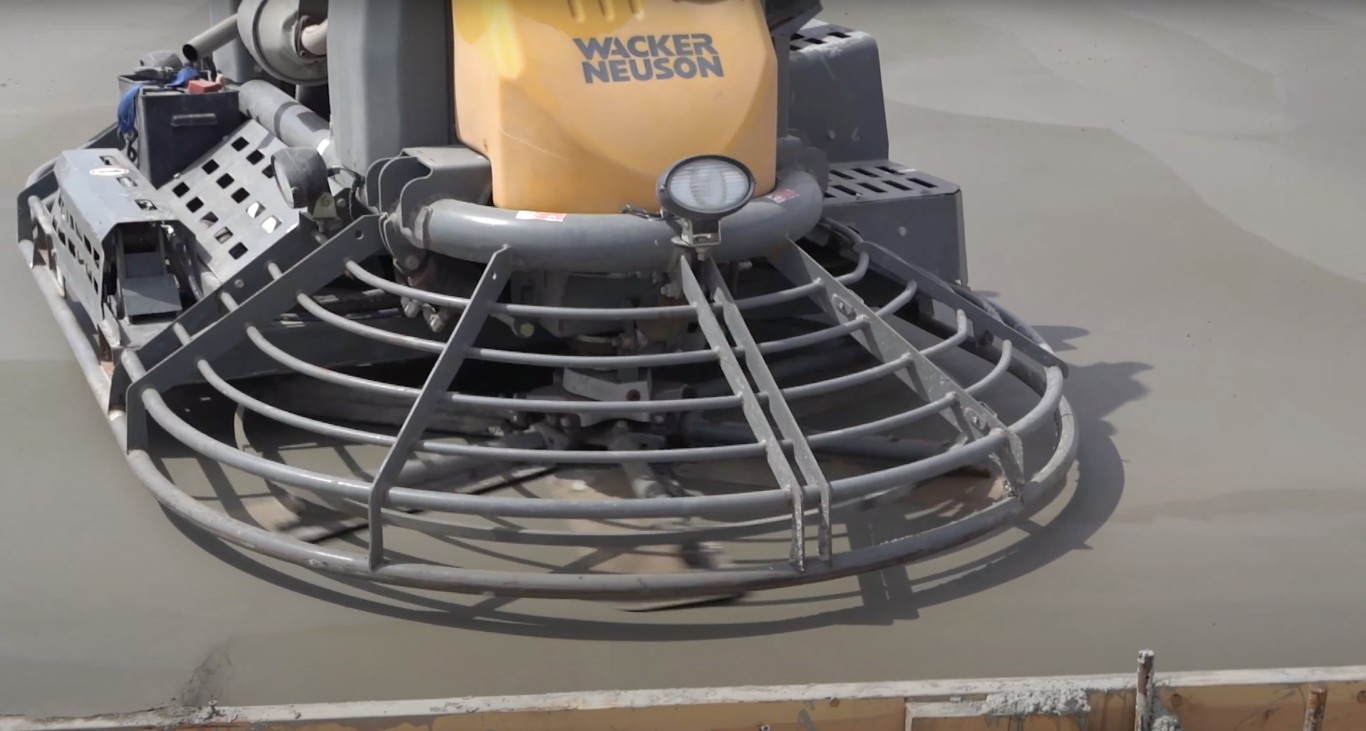 Power trowel finishing concrete surface in Meriden, CT